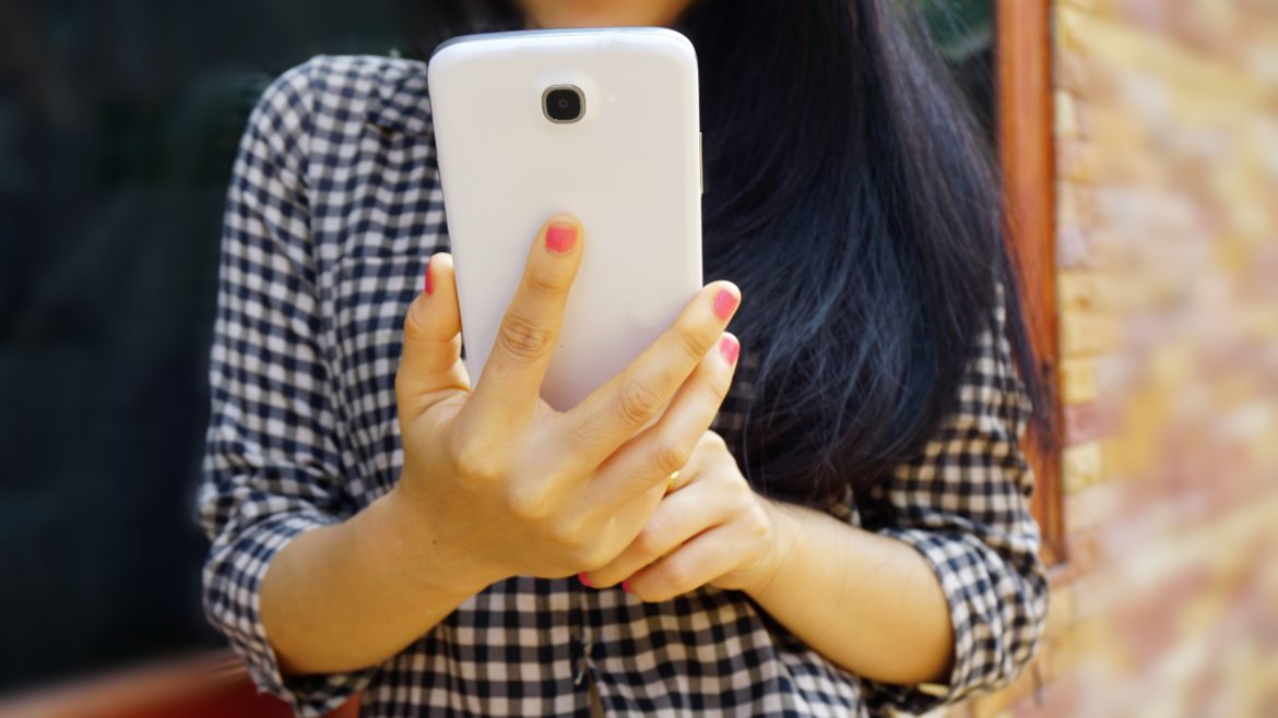 teen girl using cell phone