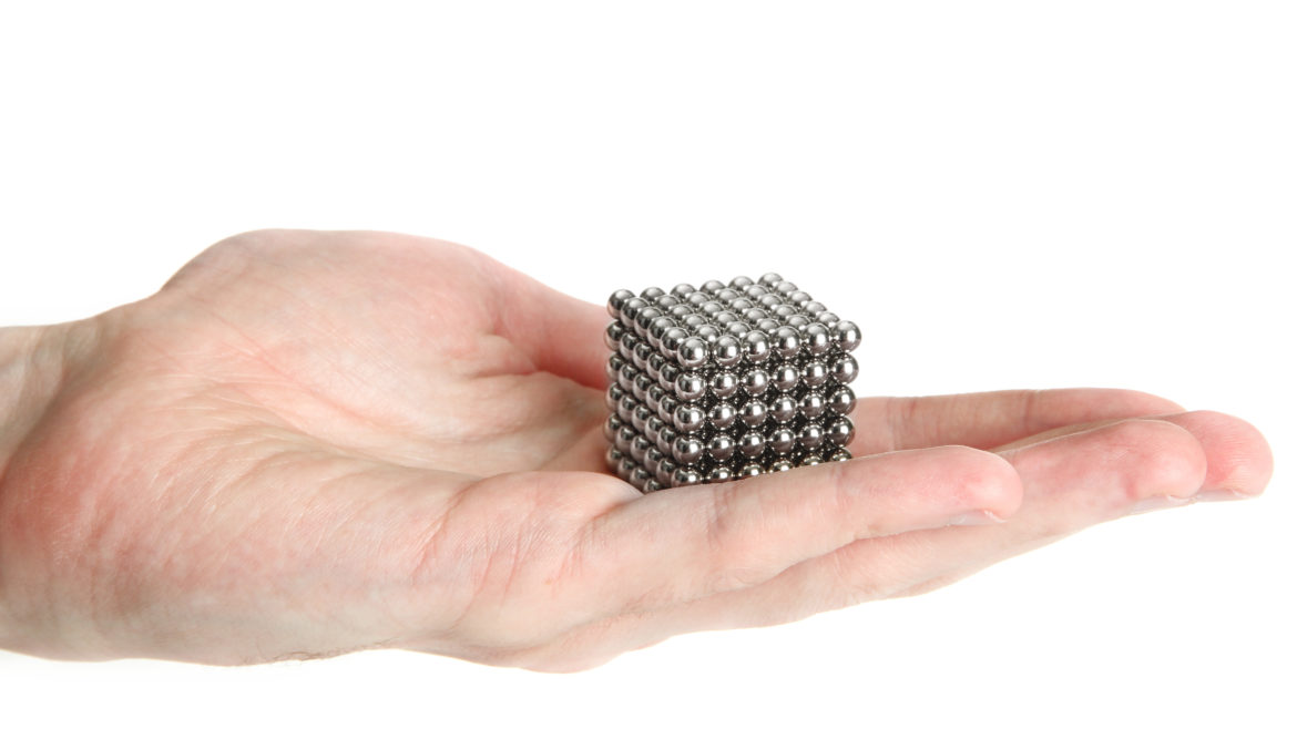 cube made of ball magnets in the palm of a hand