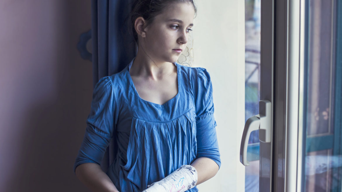 Girl with cast on her arm
