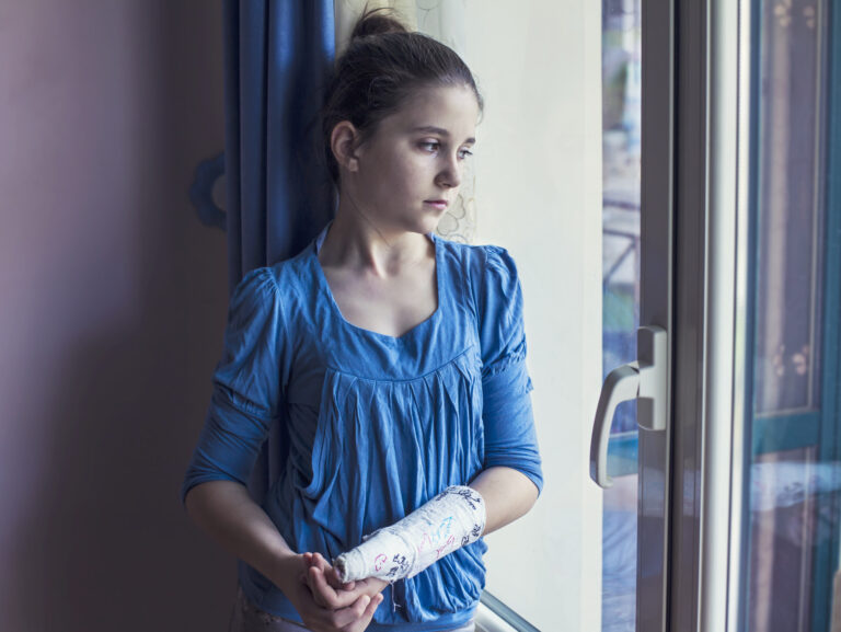 Girl with cast on her arm