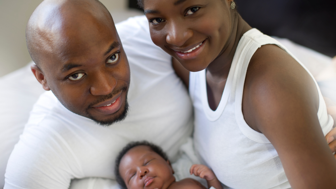 Black couple with newborn
