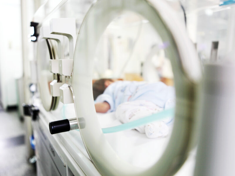 Newborn baby in an incubator at the NICU