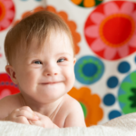 Smiling baby with Down syndrome