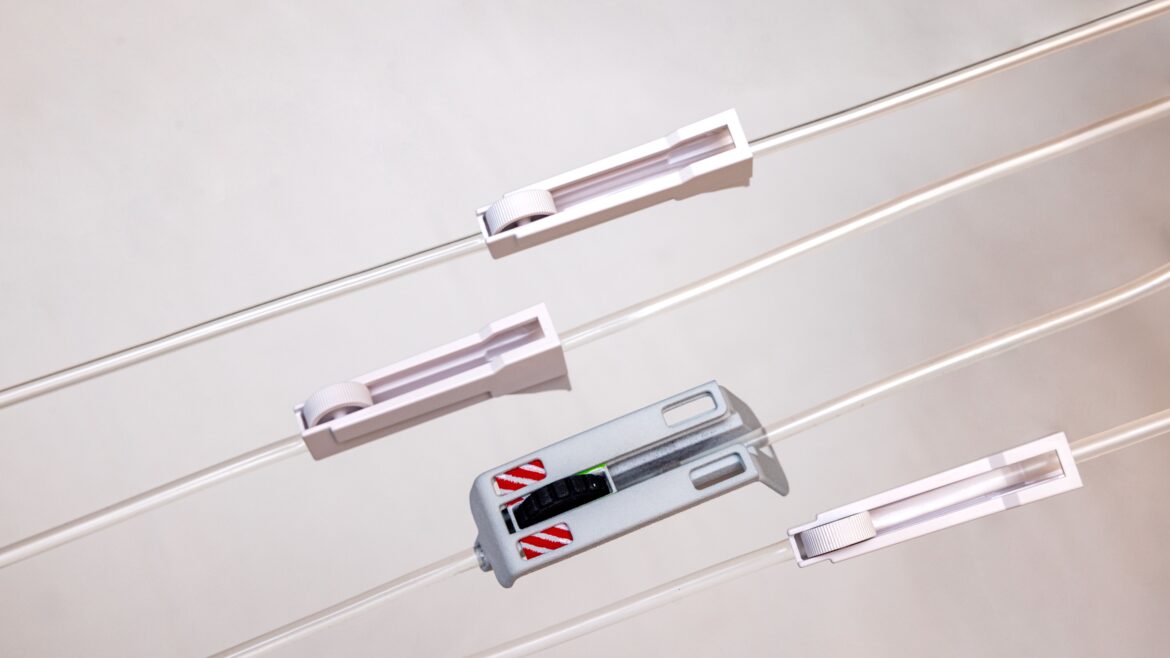 Close-up of newly designed IV line clamps that improve patient safety and usability in hospitals by providing secure, easy-to-adjust flow control for intravenous therapy.