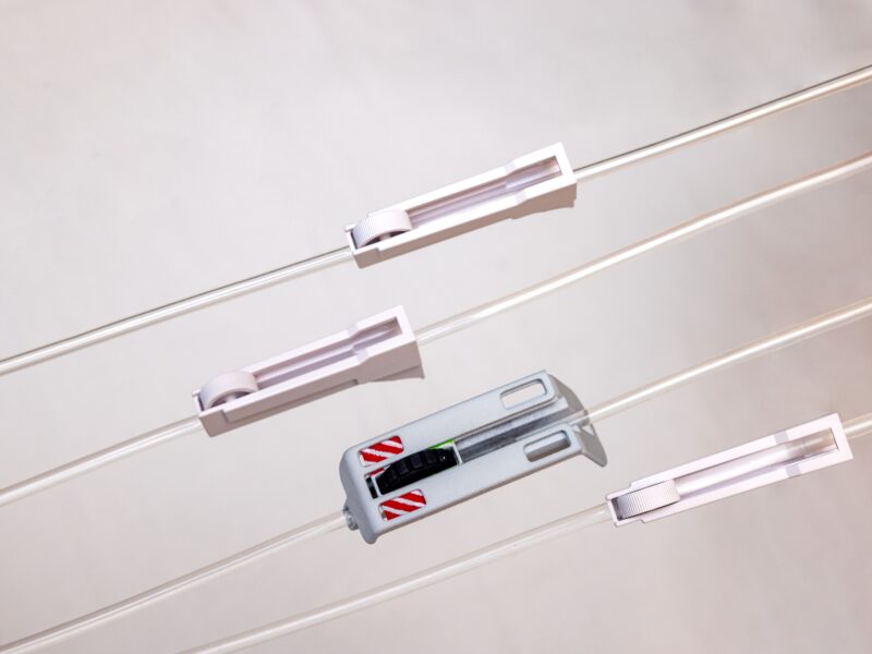 Close-up of newly designed IV line clamps that improve patient safety and usability in hospitals by providing secure, easy-to-adjust flow control for intravenous therapy.