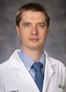 Professional portrait of Dr. Mykyta Artomov, PhD